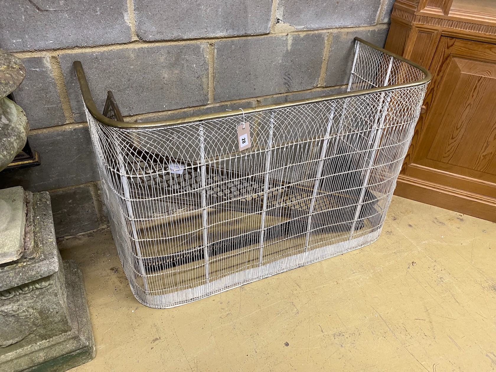 A 19th century brass tipped white painted wire mesh fire guard, width 100cm, depth 45cm, height 66cm, together with two fenders
